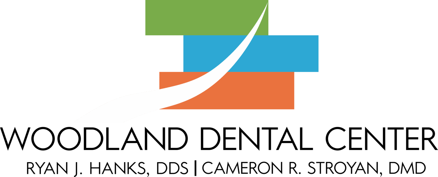 Woodland Dental Center logo